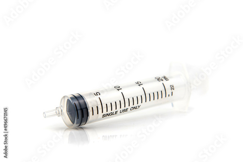 closeup plastic syringe on white background