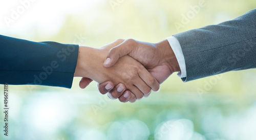 Im glad we could agree on this. Closeup shot of two unrecognisable businesspeople shaking hands in an office.