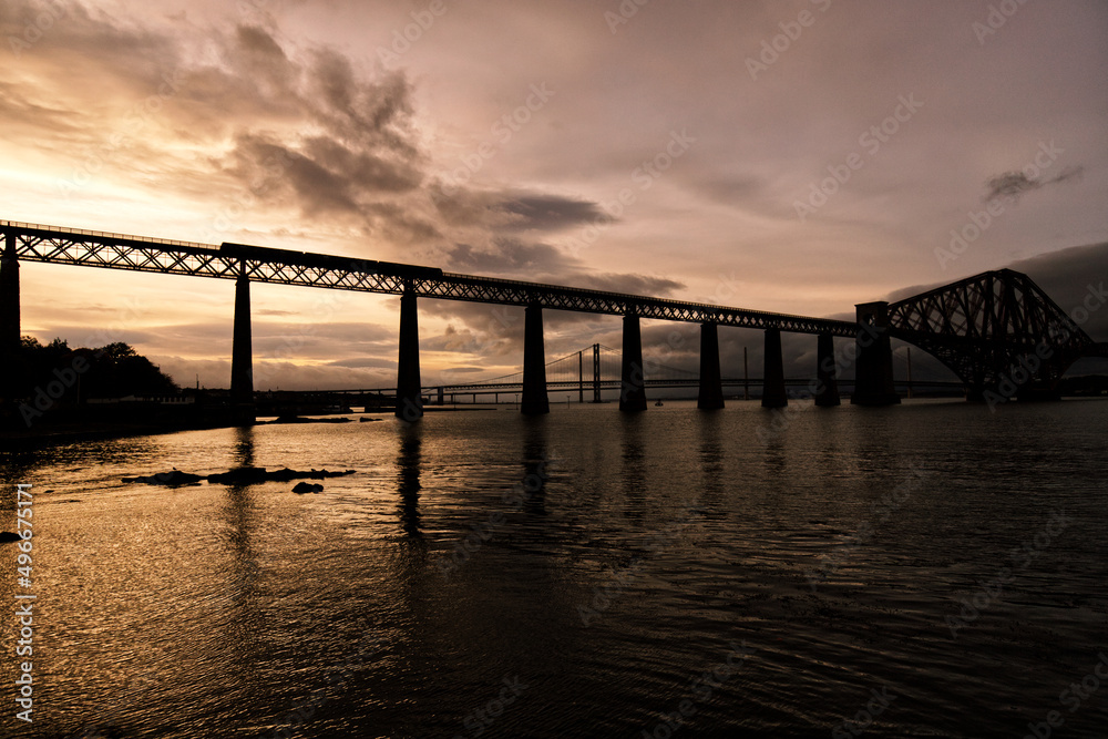 The train trip through Forth Rail Bridge to Firth of Forth - The photo was taken during the sunset showing the train going in the direction of Firth Forth.

