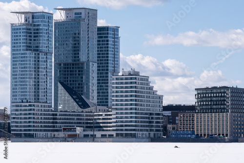 Modern highrise residential area on the waterfront during the wintertime.