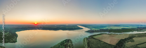 Magnificent aerial view of the Dniester River with picturesque banks during dawn. Bakota National Natural Park, Podolskie Tovtry, Ukraine. Beautiful view from a flying drone.