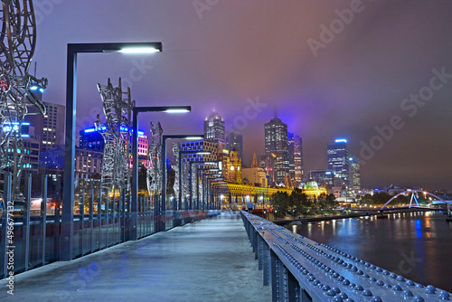 Sandridge footbridge spanning the River Yarra in Melbourne illuminated at night