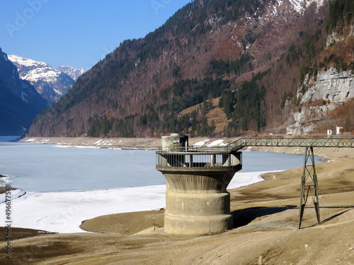 Overflow tower or   berlaufturm  or Ueberlaufturm  on the Kl  ntalersee alpine reservoir lake  or Kloentalersee or Klontaler lake  - Canton of Glarus  Switzerland  Schweiz 