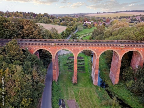 Aerial drone view of Eynsford viaduct, arched brick bridge for railway tracks over the river Darent. Kent, England, UK. photo