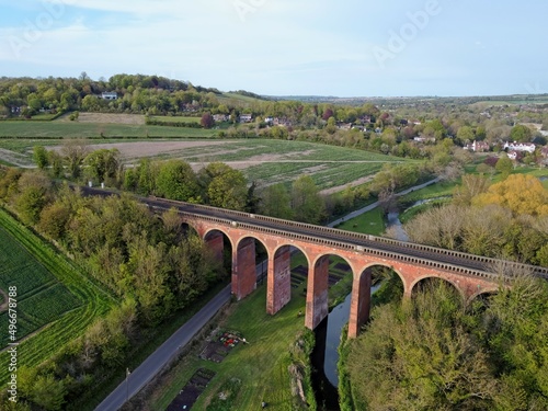 Aerial drone view of Eynsford viaduct, arched brick bridge for railway tracks over the river Darent. Kent, England, UK. photo