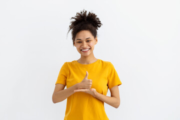 Deaf mute young African American woman on white background