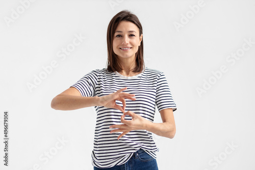 Deaf mute young caucasian woman on white background photo