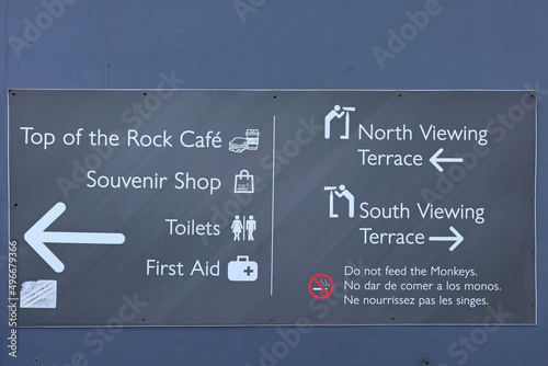 Information sign at the top of the Rock of Gibraltar. There is a warning not to feed the monkeys in several languages