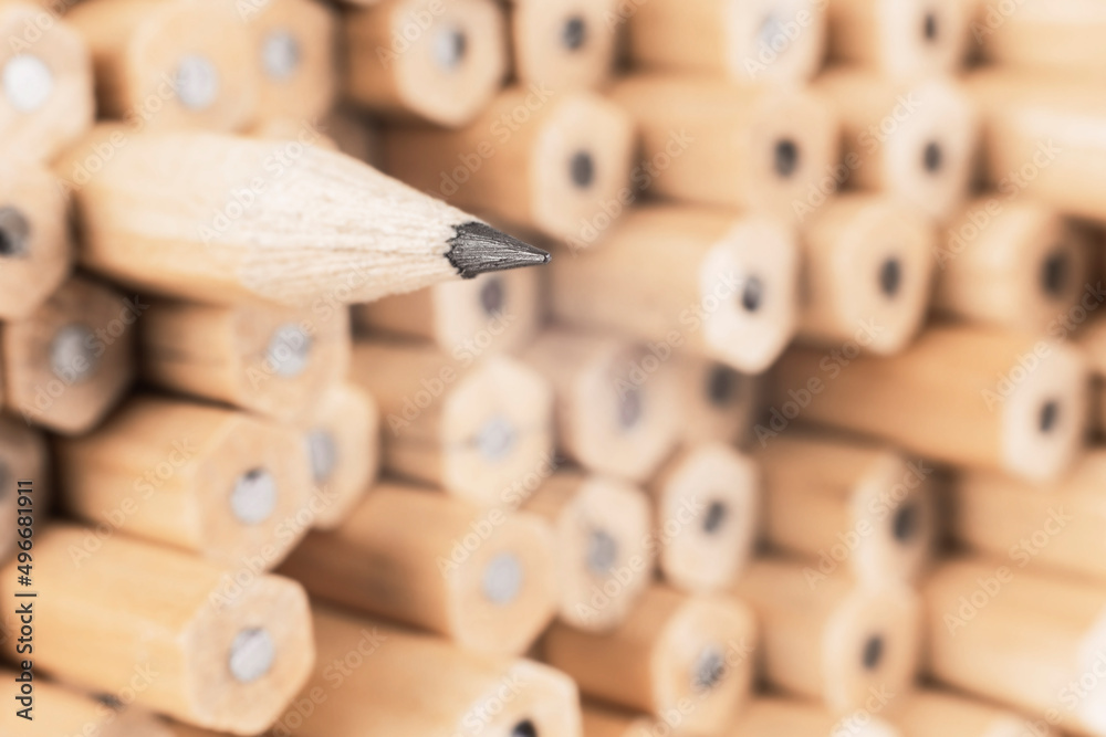 image of a sharp simple wooden pencil against other pencils, symbolizing a concept that stands out from the crowd image of a sharp simple wooden pencil against other pencils, symbolizing a concept that stands out from the crowd