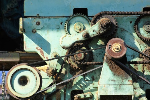 Old engine for transmitting motion with gear wheel and belt