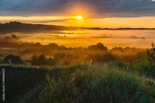 Foggy morning over the steppe and the river. Dawn in the fog.