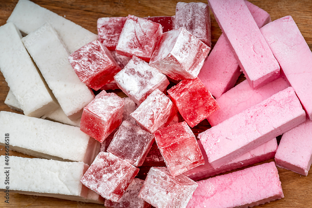 Jelly bites sweet, fruit flavoured confectionery coated with powdered sugar. Toffee candied