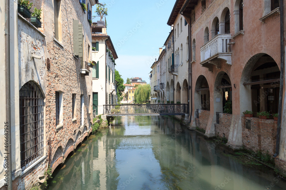 Canal Canale dei Buranelli with houses and bridge in Treviso, Italy