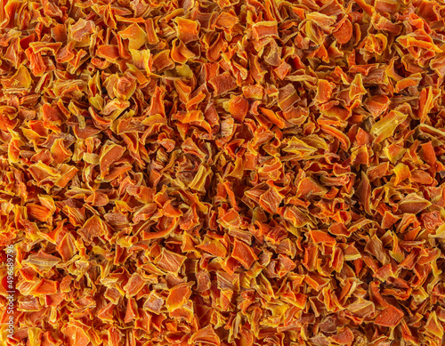  dried carrot pieces background. Spices and food ingredients.