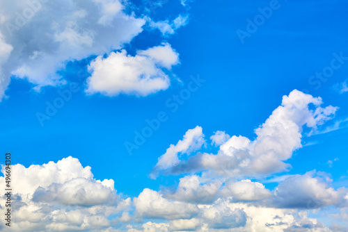 One isolated white cloud in a blue sky. Heaven background. Wallpaper. Beautiful cloudscape. Cumulus clouds. Weather forecast. Outdoor natural landscape. Banner. Dreams. Summer season © Hanna