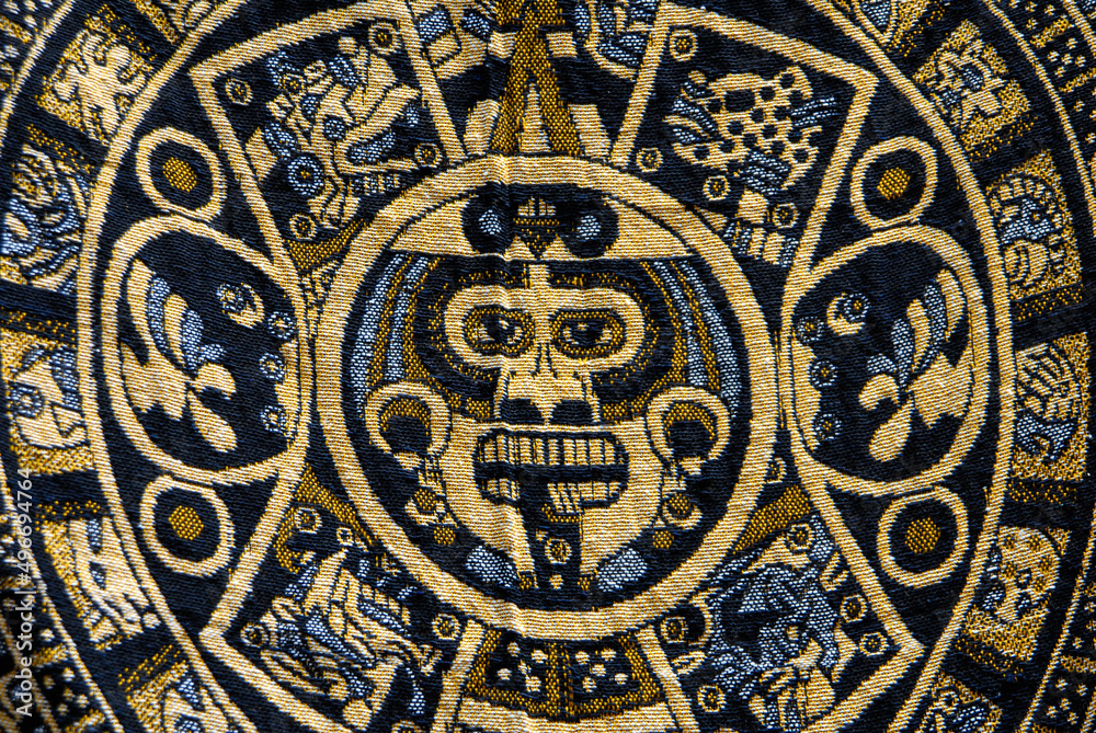 stone of the sun or Aztec calendar or solar calendar embodied in a Mexican textile or handicraft