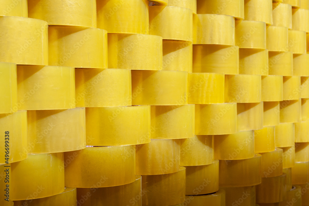 Wall of transparent yellow tape. Background from adhesive tape. Wall of transparent yellow tape. Background from adhesive tape.