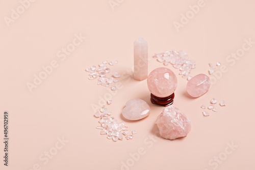 Healing reiki chakra crystals therapy. Alternative rituals with pink quartz for wellbeing, meditation, relaxation, mental health, spiritual practices. Energetical power concept