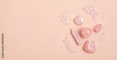 Healing reiki chakra crystals therapy. Alternative rituals with pink quartz for wellbeing, meditation, relaxation, mental health, spiritual practices. Energetical power concept photo