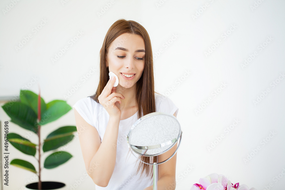 Happy beautiful young woman get ready in bathroom do make up daily morning routine in bath at home Happy beautiful young woman get ready in bathroom do make up daily morning routine in bath at home