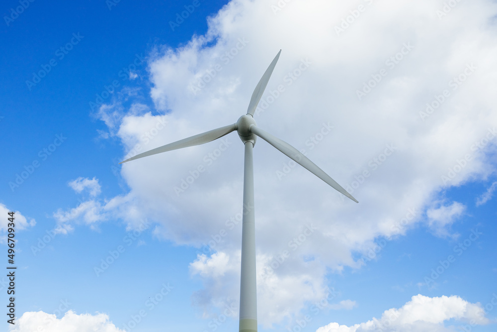 Wind turbine with blue sky as background. Energy transition in Germany. Green energy generated by wind 