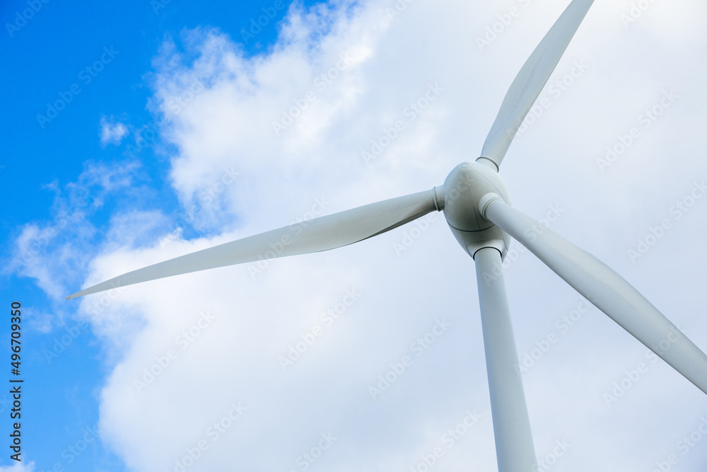 Wind turbine with blue sky as background. Energy transition in Germany. Green energy generated by wind Wind turbine with blue sky as background. Energy transition in Germany. Green energy generated by wind