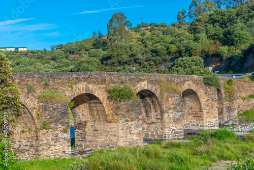 Roman bridge over Aalgon river in Spain. photo