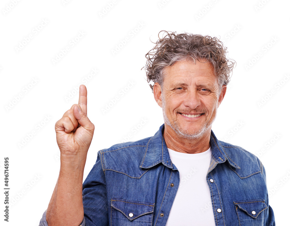 Take a look up there. Studio portrait of a happy mature man pointing upwards isolated on white.