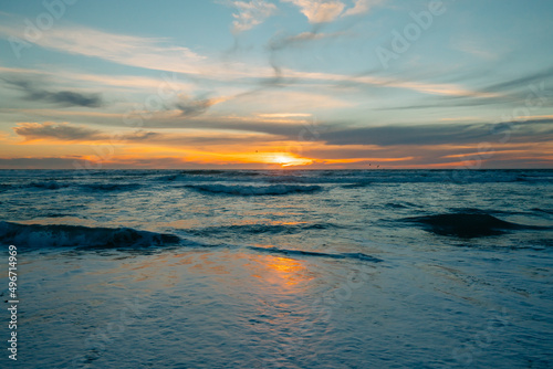 Scenic seascape, sunset over the ocean. Tranquil scene, beautiful sun reflection and stormy ocean