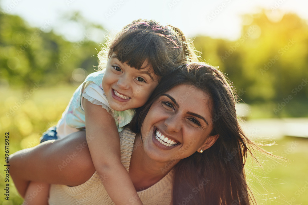 Appreciate every moment spent together. Shot of an adorable little girl and her mother enjoying a piggyback ride in the park. Appreciate every moment spent together. Shot of an adorable little girl and her mother enjoying a piggyback ride in the park.
