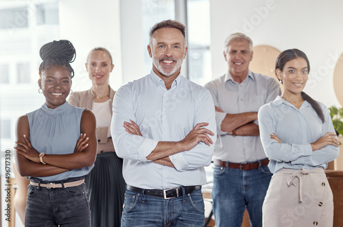 Team commitment makes a company grow. Portrait of a group of confident businesspeople working together in a modern office.