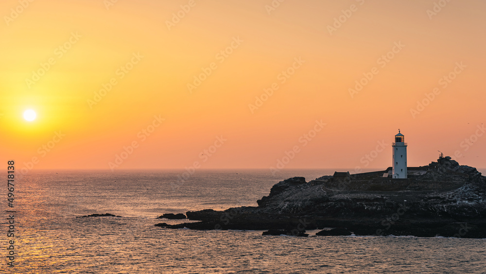 Sunset over Godrevy Lighthouse, Cornwall, England, Europe