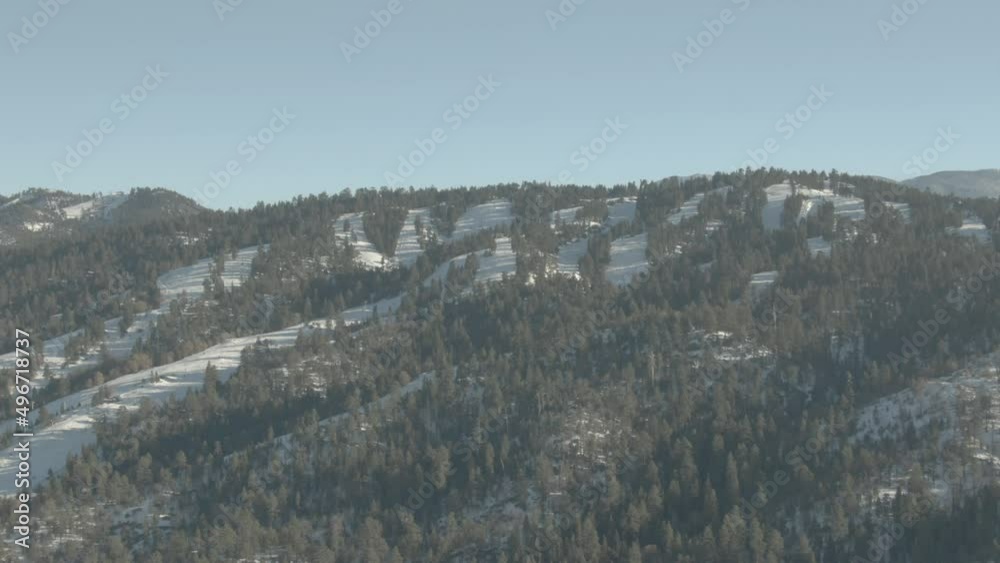 High aerial above Big Bear Ski Resort winter on blue sky day High aerial above Big Bear Ski Resort winter on blue sky day