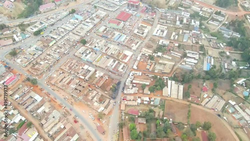 urban setting with unassuming buildings and poor roads in Kenya, Africa. aerial drone view kamatira in west pokot, kapenguria, Kenya. traditional rural community in Kenya Africa. photo