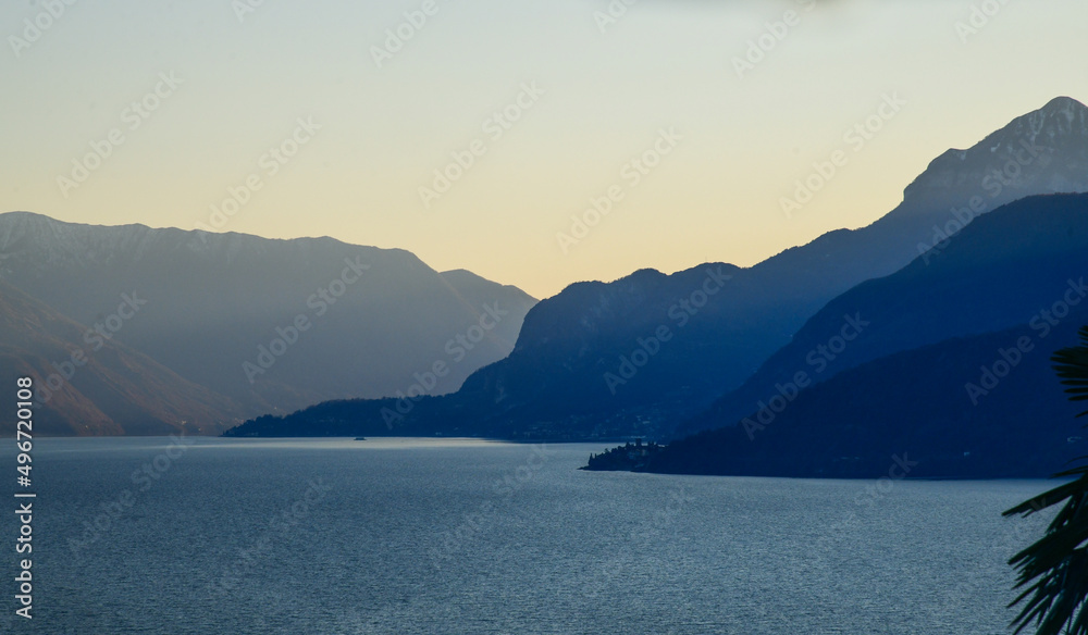 Beautiful sunset view of Alp Mountains silhouette at Lake Como, Italy. Gradient sky.