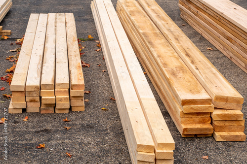 Lumber for a home addition, piled in the driveway photo