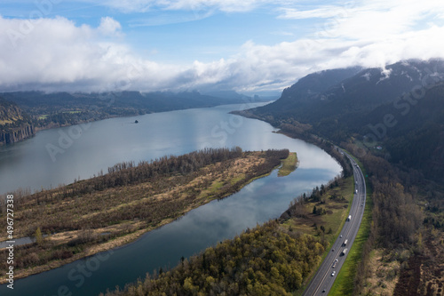 Low clouds drift over the Columbia River which runs between Oregon and Washington. The scenic Columbia River Gorge, with the Columbia River flowing through it, is over 80 miles long.