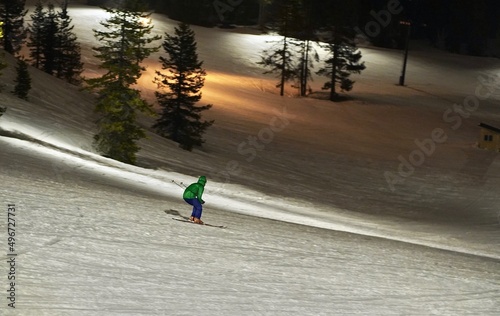 person night skiing downhill