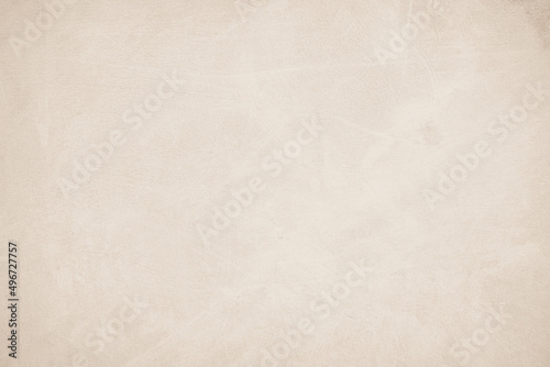 Old concrete wall texture background. Close up retro plain beige color cement material surface rough and brown paper design element concept.