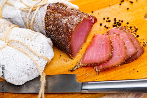 Bilde på lerret Delicious spicy cured pork sirloin produced by traditional methods, thinly slice