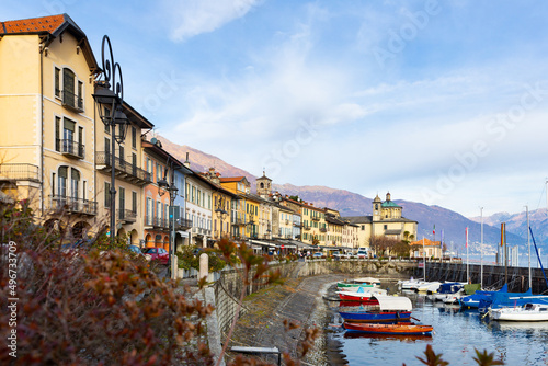Buildings and boats along lakeshore in Cannobio, Piedmont, Italy. Lake Maggiore embankment.