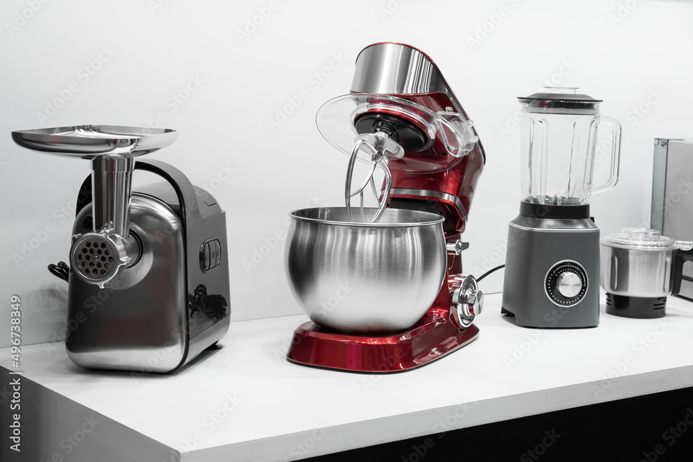 Kitchen electrical appliances and equipment, new small household appliances.  Meat grinder, planetary mixer and blender on the table Stock Photo | Adobe  Stock
