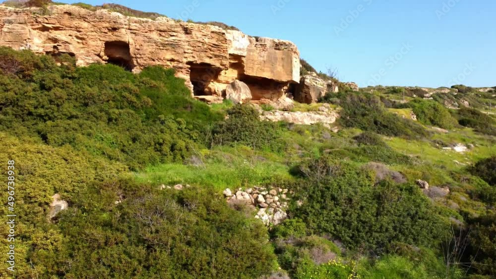 Caves in the mountains on the Mediterranean coast in Cyprus. Drone aerial video. Caves in the mountains on the Mediterranean coast in Cyprus. Drone aerial video.