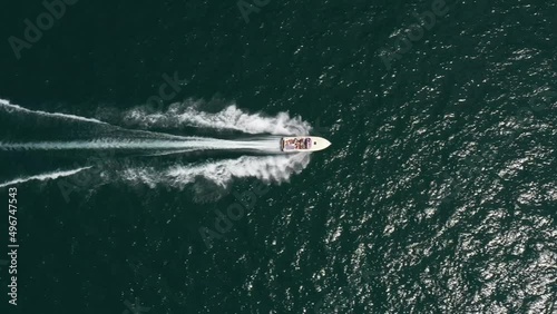 Wallpaper Mural Flying over a moving boat on the water drone view. Speedboat moves fast on the water top view. Torontodigital.ca