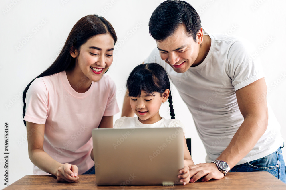 Portrait enjoy happy smiling love asian family father and mother with little asian girl learning and looking at laptop computer studying with online education e-learning system with teacher at home Portrait enjoy happy smiling love asian family father and mother with little asian girl learning and looking at laptop computer studying with online education e-learning system with teacher at home