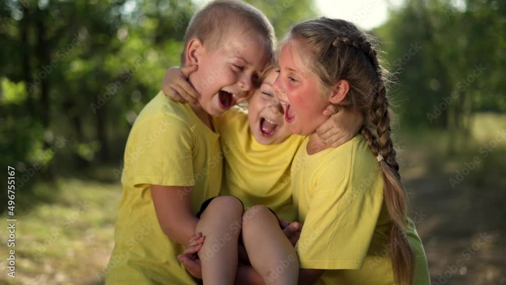 Group of happy children having fun in park. Children play in a field in green grass. Active boy play with girl in the garden. Friend child on nature in park. Happy family concept.Child dream in spring Group of happy children having fun in park. Children play in a field in green grass. Active boy play with girl in the garden. Friend child on nature in park. Happy family concept.Child dream in spring