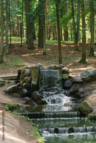 Minsk, Belarus. August 2021. Waterfall in the Drozdy Forest Park photo