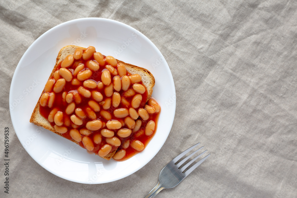 Delicious English Beans on Toast, top view. Flat lay, overhead, from above. Copy space. Delicious English Beans on Toast, top view. Flat lay, overhead, from above. Copy space.