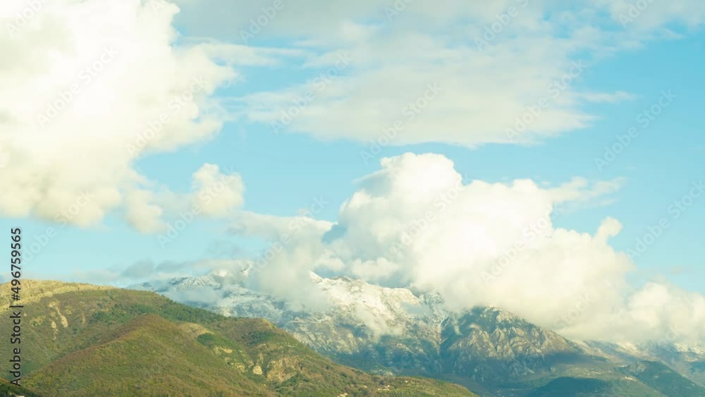 Timelapse of a beautiful sky with clouds at sunset.Time lapse of clouds and snow clad mountains while blue sky in the background. Shadow of clouds creating patterns on the mighty barren mountains Timelapse of a beautiful sky with clouds at sunset.Time lapse of clouds and snow clad mountains while blue sky in the background. Shadow of clouds creating patterns on the mighty barren mountains