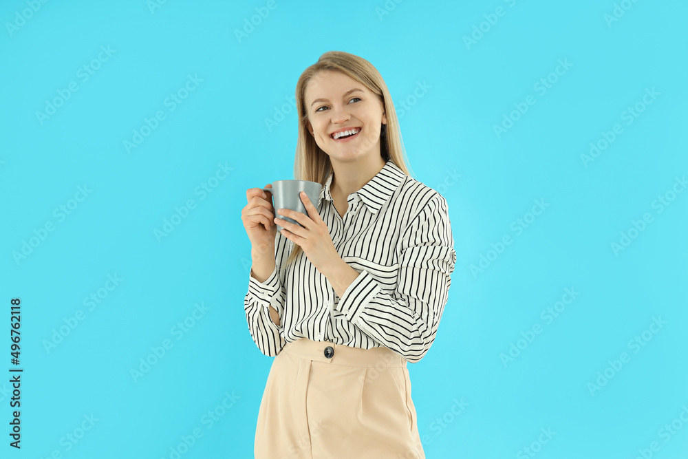 Concept of business with young attractive business woman on blue background Concept of business with young attractive business woman on blue background